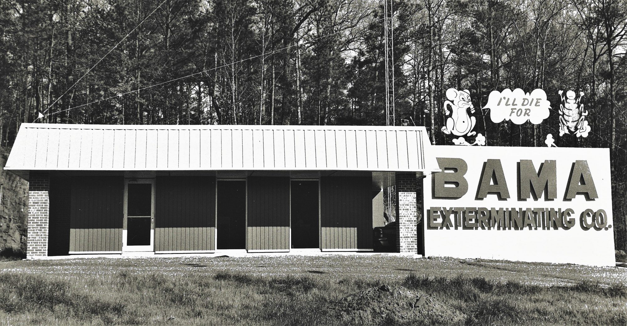 The former Bama Exterminating office with the big I'll Die For Bama sign